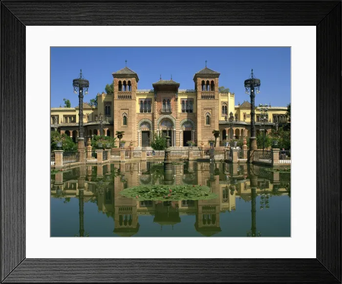Framed Print : Reflections in the lily pond of buildings on the Plaza de Espana in the city of Seville Framed Print : Reflections in the lily pond of buildings on the Plaza de Espana in the city of Seville
