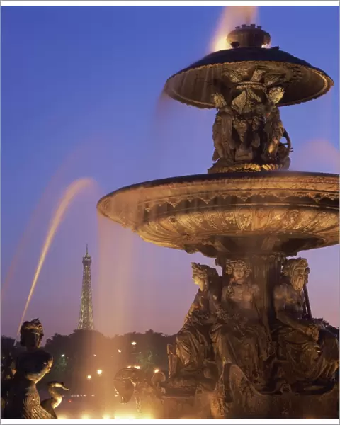 The water fountain in the Place de la Concorde with the Eiffel Tower beyond