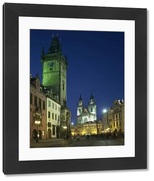 The Old Town Hall and Gothic Tyn church illuminated at night in the city of Prague