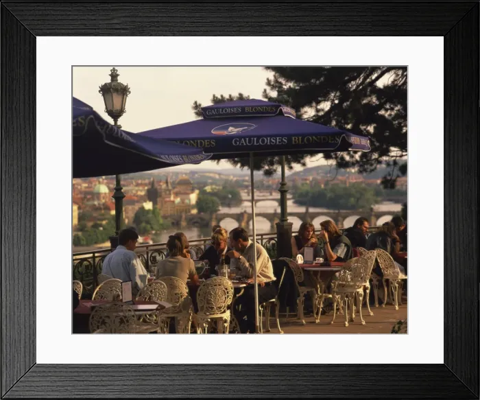 Framed Print : People at cafe tables in the open air at the Hanavsky Pavilion, with the river