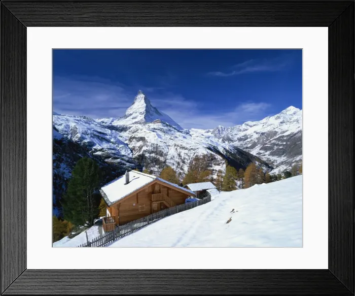 Framed Print : Chalets in a snowy landscape with the Matterhorn peak, near Zermatt, Swiss Alps Framed Print : Chalets in a snowy landscape with the Matterhorn peak, near Zermatt, Swiss Alps