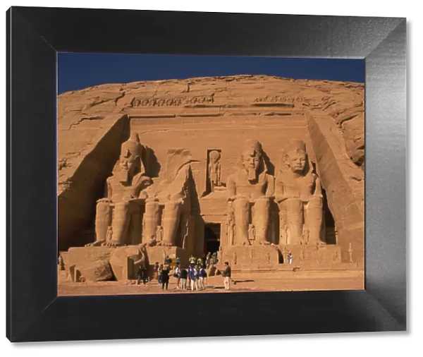 Tourists in front of the Temple of Re-Herakhte, built for Ramses II, also known as the Sun or Great Temple of Ramses II, Abu Simbel, UNESCO World Heritage Site, Nubia, Egypt, North