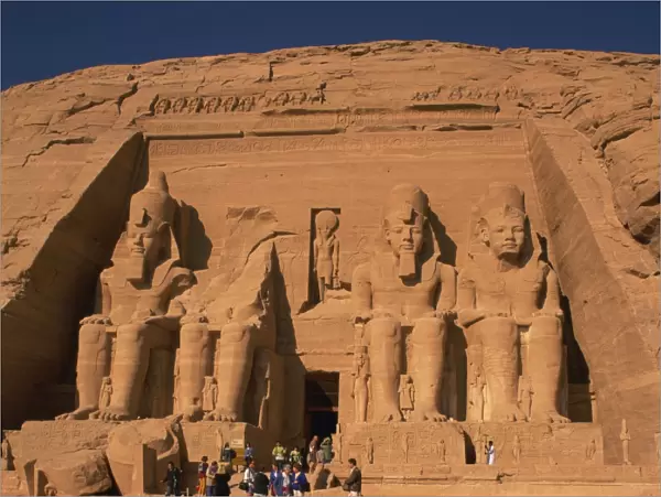 Tourists in front of the Temple of Re-Herakhte, built for Ramses II, also known as the Sun or Great Temple of Ramses II, Abu Simbel, UNESCO World Heritage Site, Nubia, Egypt, North