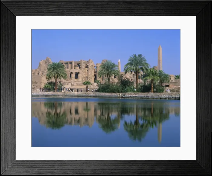 Framed Print : Reflections in the sacred lake of the temple, obelisks and palm trees at Karnak Framed Print : Reflections in the sacred lake of the temple, obelisks and palm trees at Karnak