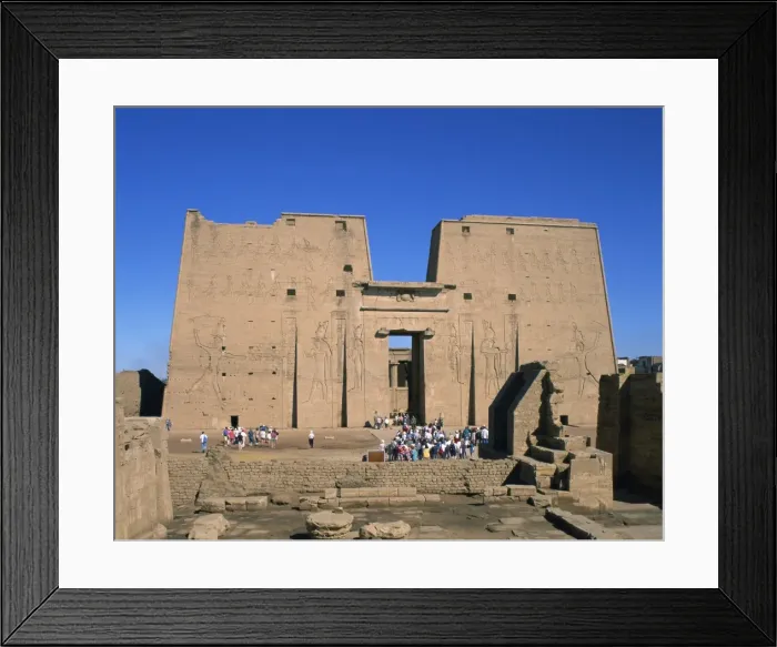 Framed Print : Crowds of tourists in front of the entrance pylon of the temple at Edfu Framed Print : Crowds of tourists in front of the entrance pylon of the temple at Edfu