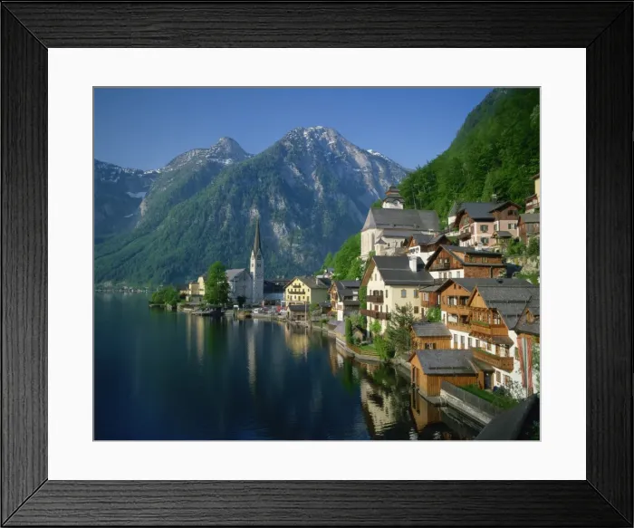 Framed Print : Houses, chalets and the church of the village of Hallstatt beside the lake Framed Print : Houses, chalets and the church of the village of Hallstatt beside the lake
