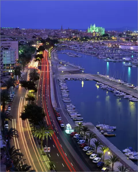 Lights at dusk, with boats in the marina and Palma cathedral across the bay