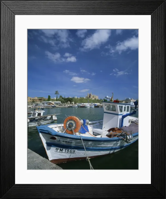 Framed Print : Fishing boat and the cathedral of Palma in the background, on Majorca, Balearic Islands Framed Print : Fishing boat and the cathedral of Palma in the background, on Majorca, Balearic Islands