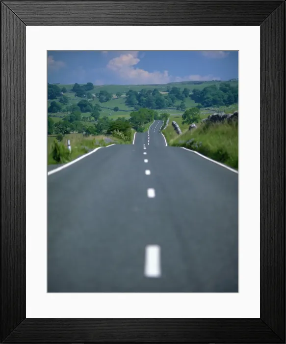 Framed Print : Undulating rural road through countryside, United Kingdom, Europe