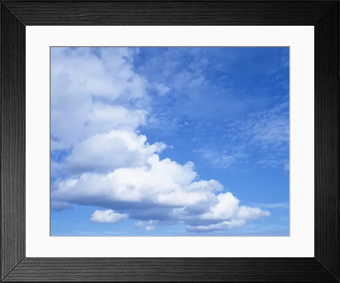 Framed Print : Cloudscape of white clouds in blue skies