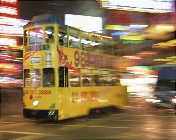 Tram in blurred motion at dusk, Causeway Bay, Hong Kong, China, Asia