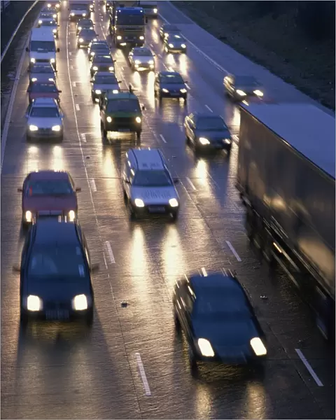 Traffic on wet motorway at dusk, United Kingdom, Europe