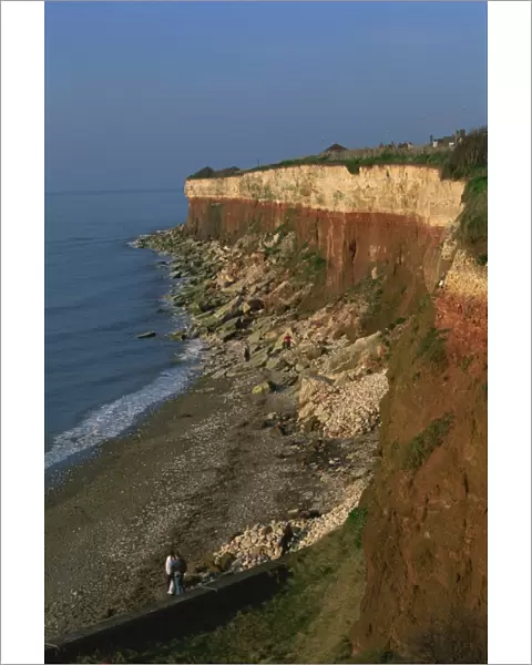 Rockfalls from red and white chalk cliff, Hunstanton, Norfolk, England