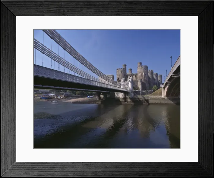 Framed Print : Telford Suspension Bridge, opened in 1826, crossing the River Conwy with Conwy Castle Framed Print : Telford Suspension Bridge, opened in 1826, crossing the River Conwy with Conwy Castle