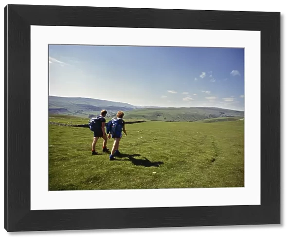 Couple walking on The Dalesway long distance footpath, near Kettlewell