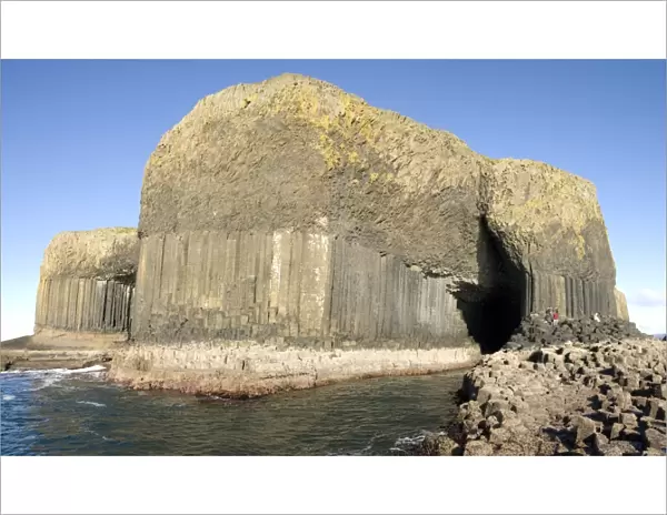 Columnar basalt lava with Fingals Cave cut into it by sea, Staffa