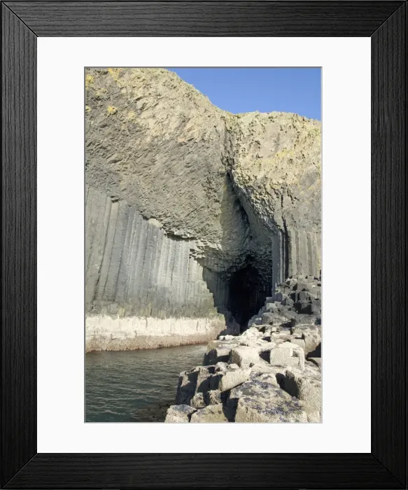 Framed Print : Columnar basalt lava with Fingals Cave cut into it by sea, Staffa Framed Print : Columnar basalt lava with Fingals Cave cut into it by sea, Staffa