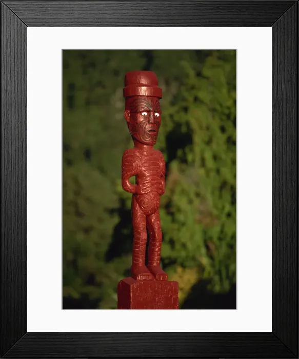Framed Print : A carved figure or poupou in a Maori village at the Whakarewarewa thermal Framed Print : A carved figure or poupou in a Maori village at the Whakarewarewa thermal