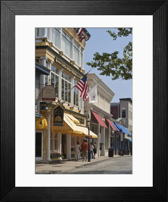 Framed Print : Smart shops and cobbled roadway of popular Thames Street in historic Newport Old Quarter Framed Print : Smart shops and cobbled roadway of popular Thames Street in historic Newport Old Quarter