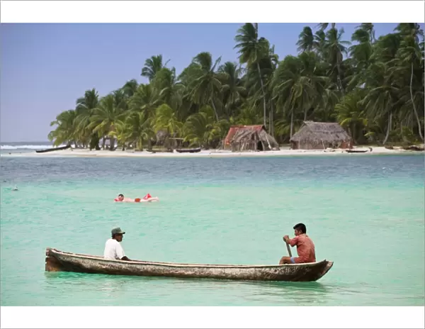 Men in dugout canoe near Devil Island, Comarca de Kuna Yala, San Blas Islands