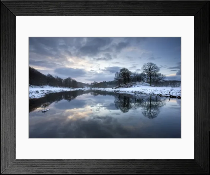 Framed Print : Winter view of River Brathay at dawn, under snow with reflections, near Elterwater Village