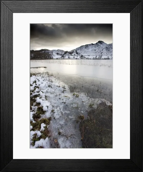 Framed Print : Frozen Little Langdale Tarn and snow-covered fells, near Ambleside, Lake District National Park