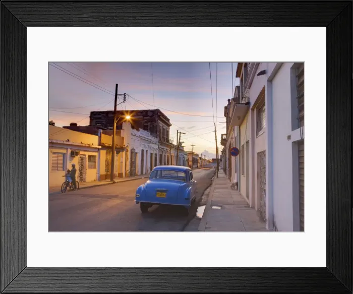 Framed Print : Street scene at twilight with classic blue American car, Cienfuegos, Cuba Framed Print : Street scene at twilight with classic blue American car, Cienfuegos, Cuba