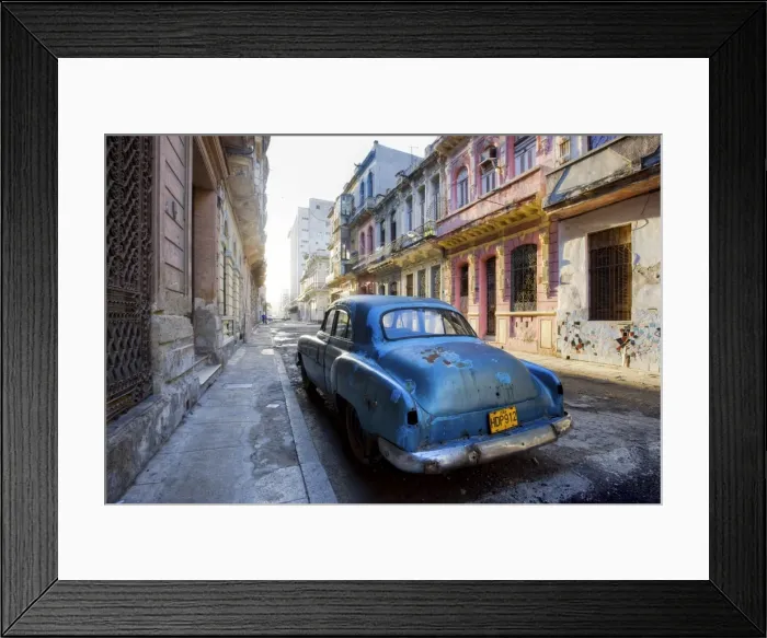 Framed Print : Dilapidated American car parked on a street of ornate colonial buildings Framed Print : Dilapidated American car parked on a street of ornate colonial buildings