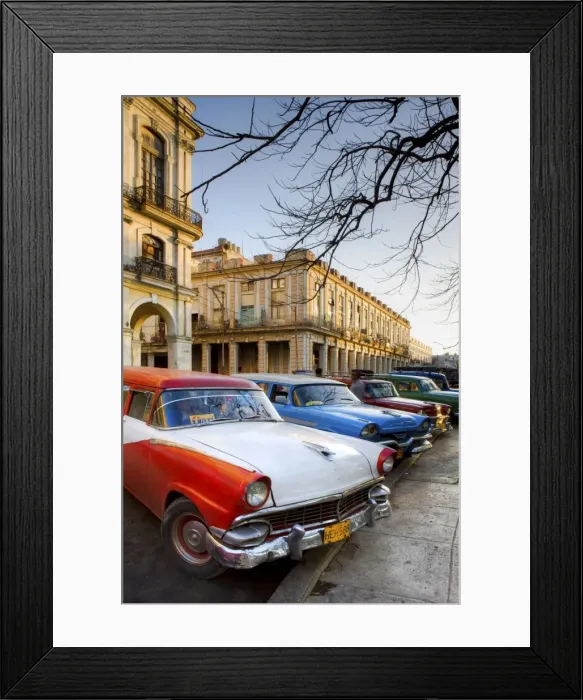 Framed Print : Classic American cars used as taxis for local people, parked outside the main railway station Framed Print : Classic American cars used as taxis for local people, parked outside the main railway station