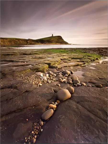 View across Kimmeridge Bay at dusk towards Hen Cliff and Clavell Tower
