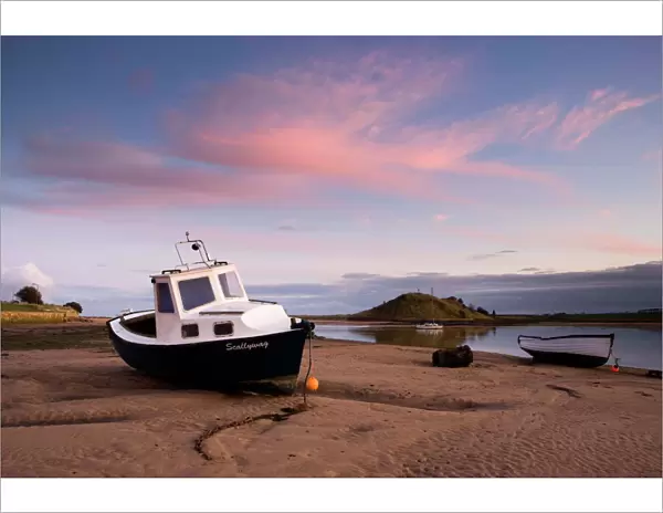 Fishing boat on the Aln Estuary at twilight, low tide, Alnmouth, near Alnwick