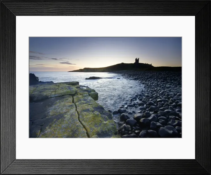 Framed Print : View across the Rumble Churn at dawn towards the ruins of Dunstanburgh Castle Framed Print : View across the Rumble Churn at dawn towards the ruins of Dunstanburgh Castle