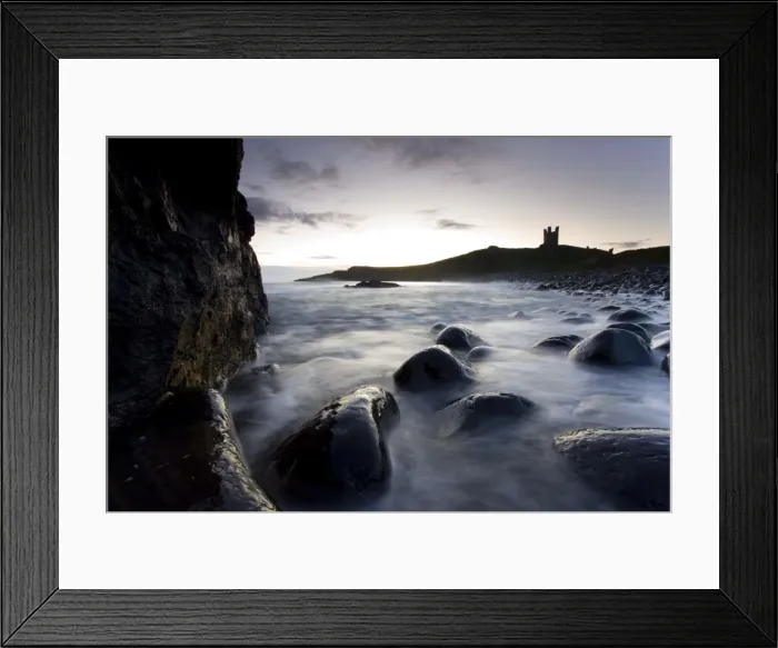 Framed Print : View across the Rumble Churn at dawn towards the ruins of Dunstanburgh Castle Framed Print : View across the Rumble Churn at dawn towards the ruins of Dunstanburgh Castle