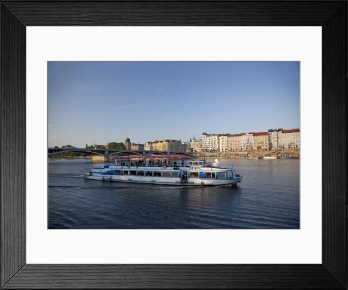 Framed Print : Sightseeing boat on Vltava River with East bank and Jiraskuv Bridge, Prague Framed Print : Sightseeing boat on Vltava River with East bank and Jiraskuv Bridge, Prague