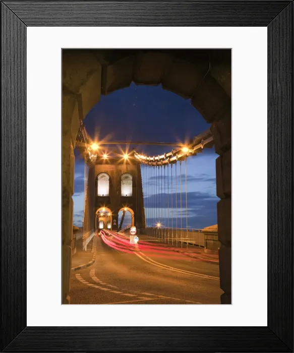 Framed Print : View along the A5 road at night across the Menai suspension bridge, built by Thomas Telford in 1825 Framed Print : View along the A5 road at night across the Menai suspension bridge, built by Thomas Telford in 1825