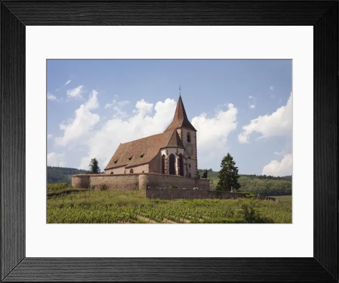 Framed Print : The 15th century fortified church of St. Jacques and Grand Cru vineyards on the Alsation wine route Framed Print : The 15th century fortified church of St. Jacques and Grand Cru vineyards on the Alsation wine route