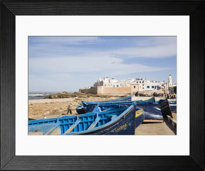 Framed Print : Small wooden fishing boats on seafront with white buildings of the Medina beyond Framed Print : Small wooden fishing boats on seafront with white buildings of the Medina beyond