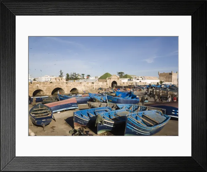 Framed Print : Blue boats in fishing port outside fortified town walls on west coast, Essaouira Framed Print : Blue boats in fishing port outside fortified town walls on west coast, Essaouira