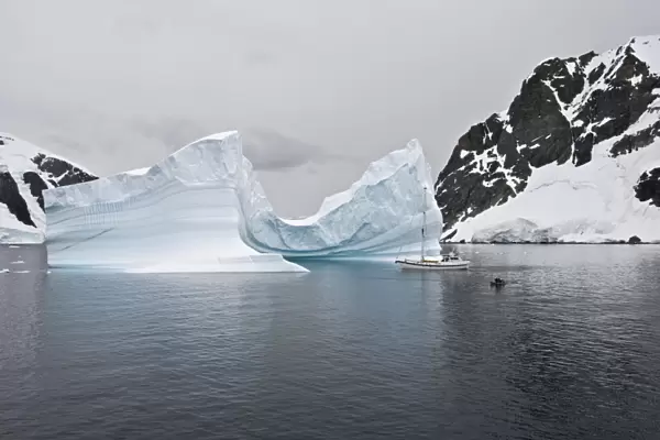 Sailing yacht and iceberg, Errera Channel, Antarctic Peninsula, Antarctica, Polar Regions