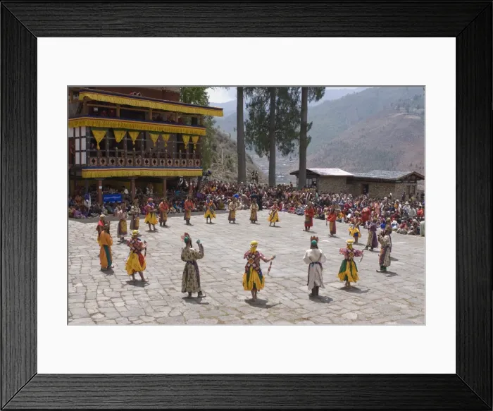Framed Print : Costumed dancers at religious festival with many visitors, Paro Tsechu
