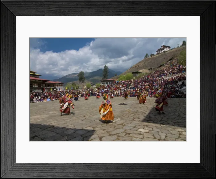 Framed Print : Costumed dancers at religious festival with many visitors, Paro Tsechu Framed Print : Costumed dancers at religious festival with many visitors, Paro Tsechu