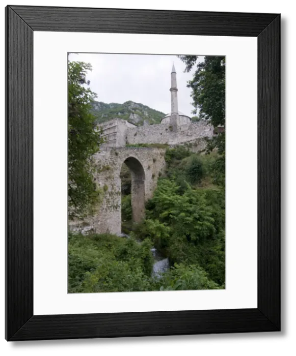 Framed Print : Old bridge in front of the medieval Castle with minaret, Travnik, Bosnia-Herzegovina Framed Print : Old bridge in front of the medieval Castle with minaret, Travnik, Bosnia-Herzegovina