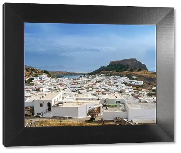 View over Lindos village towards the Acropolis, Rhodes Island, Dodecanese, Greek Islands, Greece, Europe
