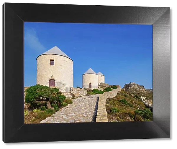 Windmills of Pandeli with Medieval Castle in the background, Leros Island, Dodecanese, Greek Islands, Greece, Europe