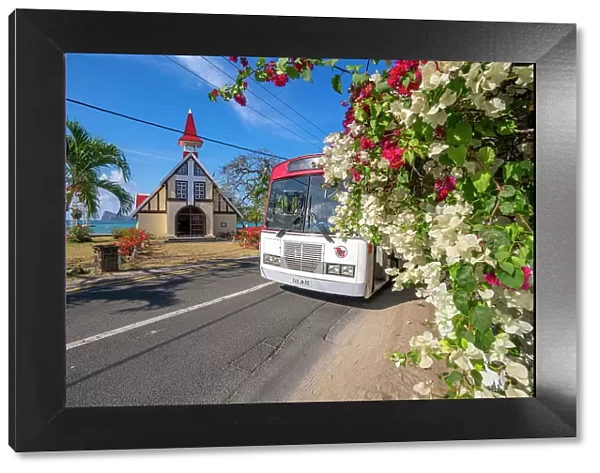 View of local bus and Notre-Dame Auxiliatrice de Cap Malheureux, Cap Malheureux, Mauritius, Indian Ocean, Africa