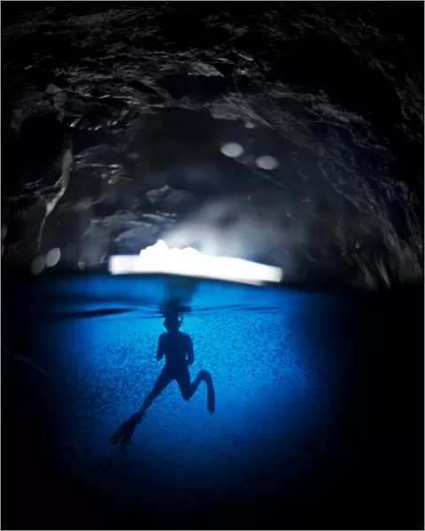 Free diving in a cave off Espanola Island, Galapagos, South America