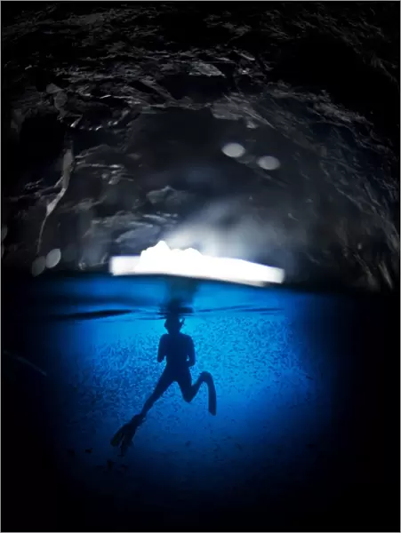 Free diving in a cave off Espanola Island, Galapagos, South America