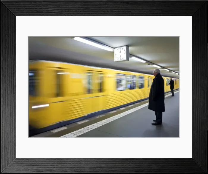 Framed Print : Moving train pulling into modern subway station, Berlin, Germany, Europe Framed Print : Moving train pulling into modern subway station, Berlin, Germany, Europe