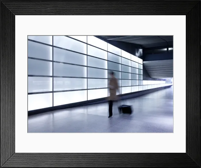 Framed Print : Person walking with motion blur in passageway at modern train station, Berlin Framed Print : Person walking with motion blur in passageway at modern train station, Berlin