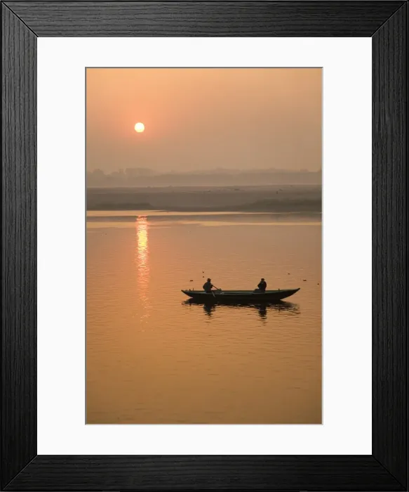 Framed Print : A photographer takes a photo from a rowing boat on the Ganga (Ganges) River at Varanasi Framed Print : A photographer takes a photo from a rowing boat on the Ganga (Ganges) River at Varanasi